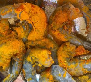 Shrimp tossed in turmeric and salt