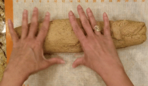 Knead keto yeast risen bread roll dough with hand